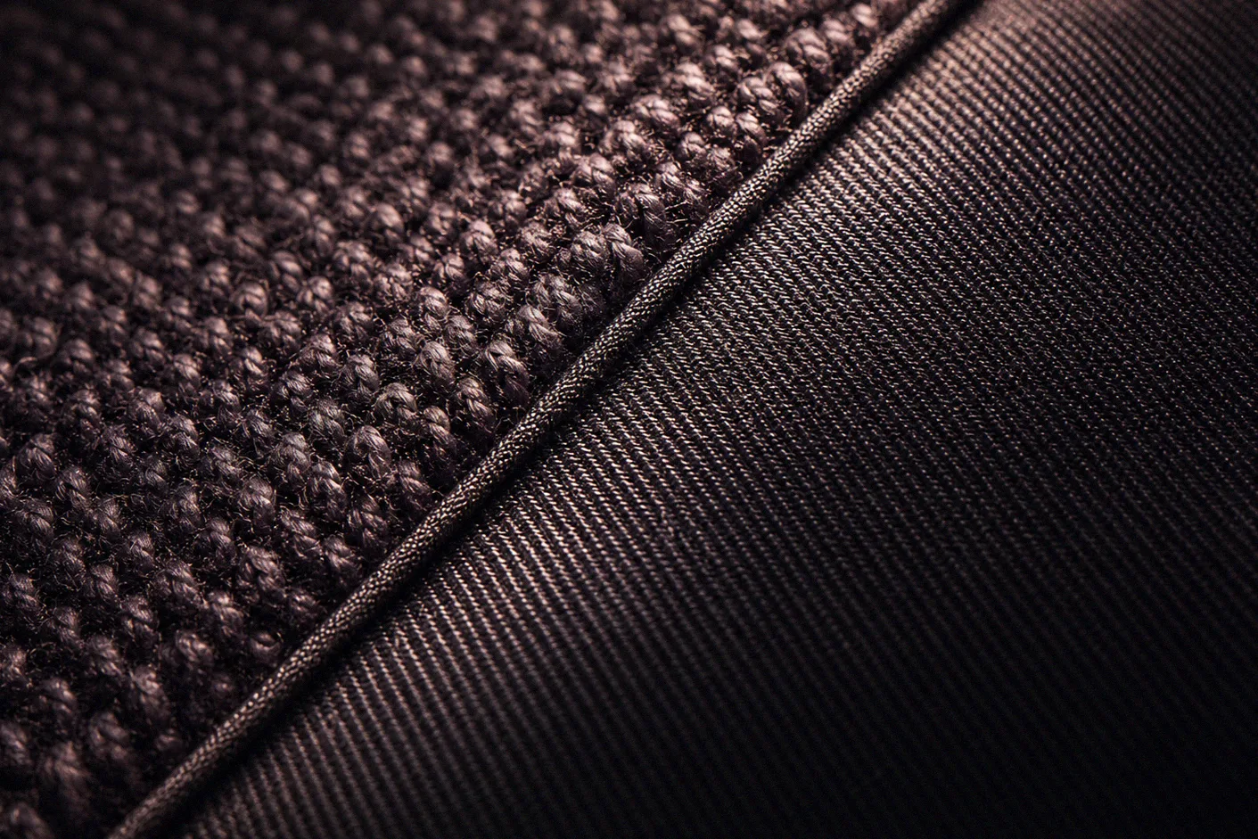 Macro of a woven textile surface showing individual fibre strands